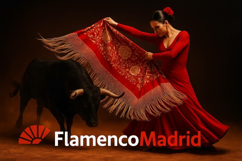 Bailaora en vestido rojo realizando un pase taurino con un mantón frente a un toro